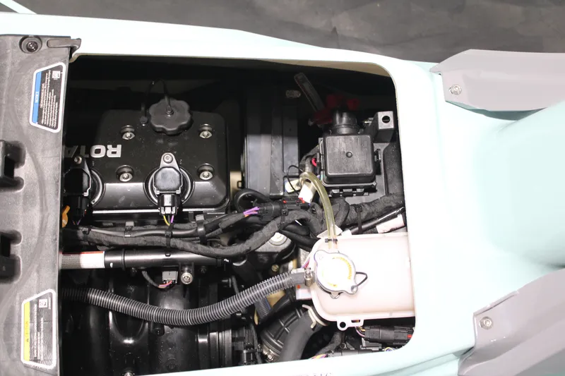 Slide: The Image of 2023 Sea-Doo Wake Pro 230 engine compartment, showcasing internal components and wiring. - 11