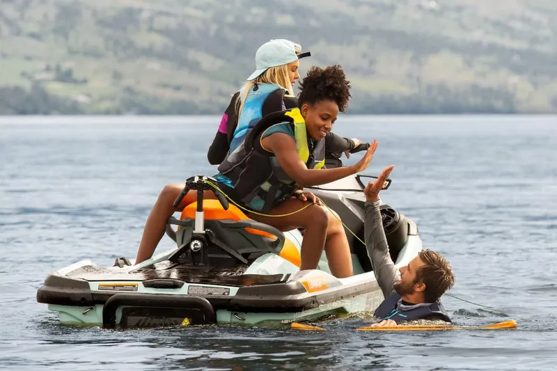 Slide: The Image of Manufacturer Provided Image: 2023 Sea-Doo Wake Pro 230 with friends enjoying water activities. - 14