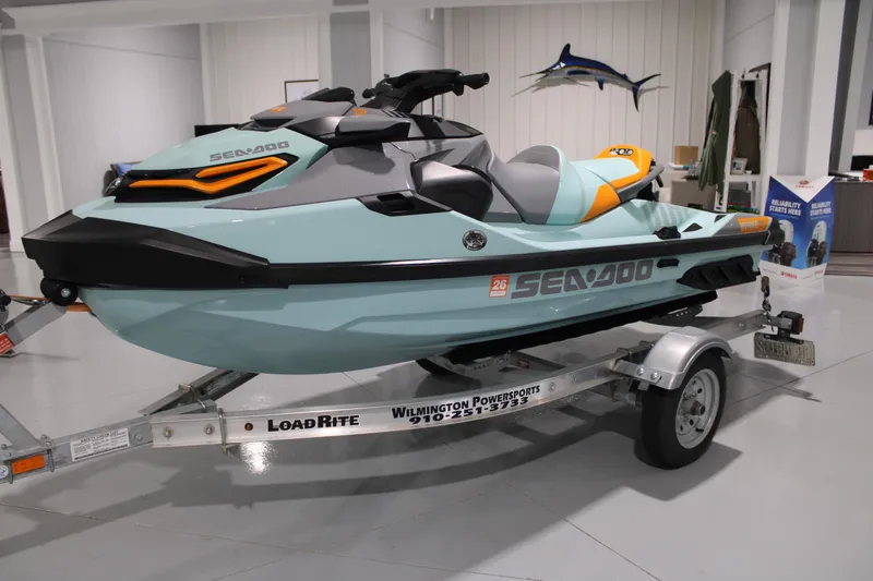 Slide: The Image of 2023 Sea-Doo Wake Pro 230 jet ski on trailer in showroom. - 6