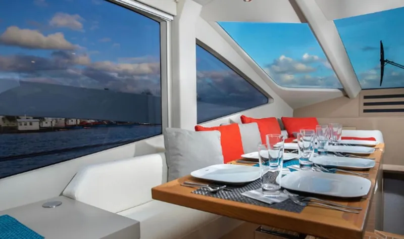 Slide: The Image of Luxurious dining area on 2019 Numarine 78 yacht with panoramic windows and elegant table setting. - 12