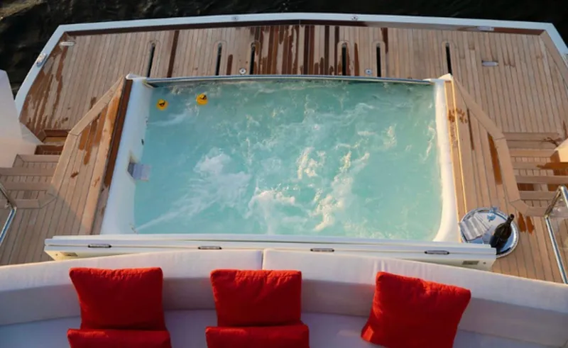 Slide: The Image of Luxurious 2019 Numarine 78 yacht deck with jacuzzi and red cushions. - 17