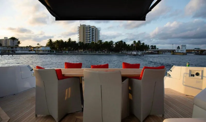 Slide: The Image of Luxury Numarine 78 yacht deck with seating, overlooking scenic waterfront view, 2019 model. - 24
