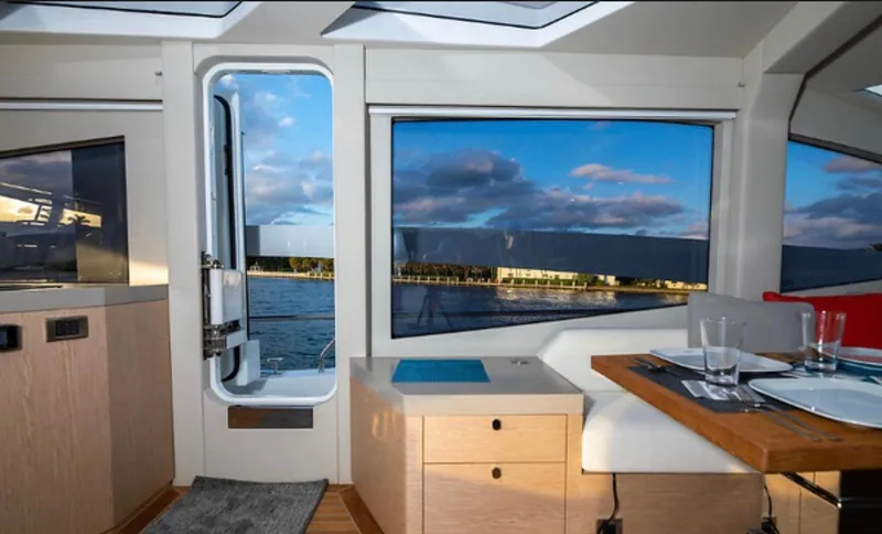 Slide: The Image of Interior of 2019 Numarine 78 yacht with scenic water view through large windows. - 25
