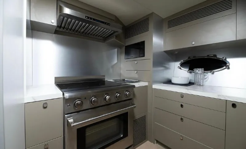 Slide: The Image of Modern kitchen in 2019 Numarine 78 yacht with stainless steel appliances and sleek cabinetry. - 26