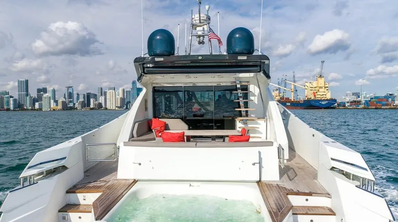 Slide: The Image of Luxury Numarine 78 yacht, 2019 model, cruising with city skyline and harbor in background. - 4