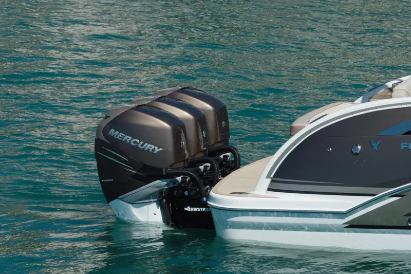 Slide: The Image of 2018 Formula 350 Crossover Bowrider OB with twin Mercury outboard engines on water. - 10