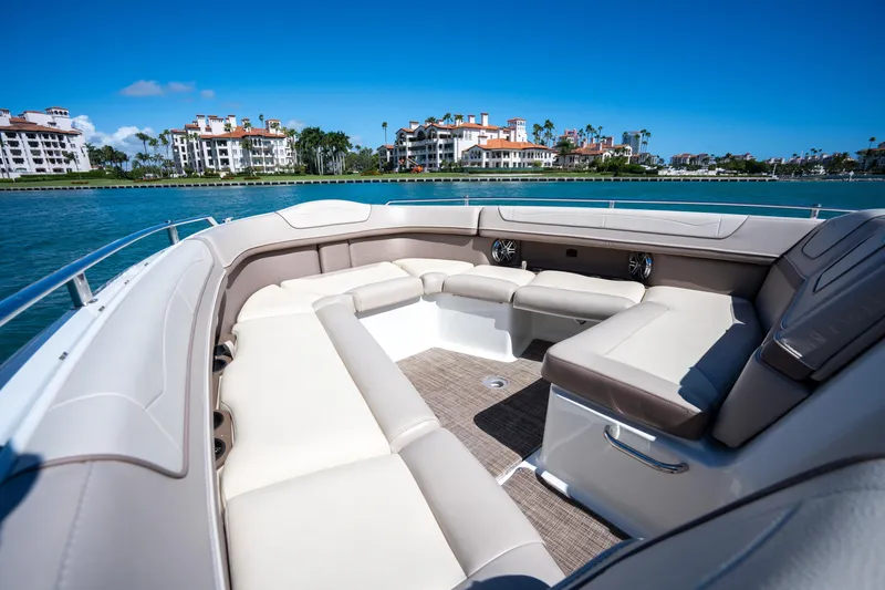 Slide: The Image of Luxurious 2018 Formula 350 Crossover Bowrider OB with spacious seating, scenic waterfront view. - 19
