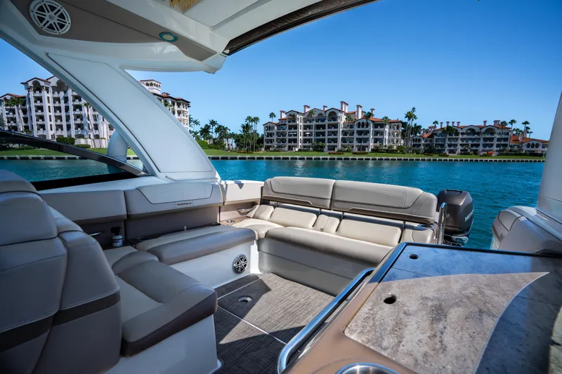 Slide: The Image of 2018 Formula 350 Crossover Bowrider OB interior with waterfront view and luxury seating. - 24