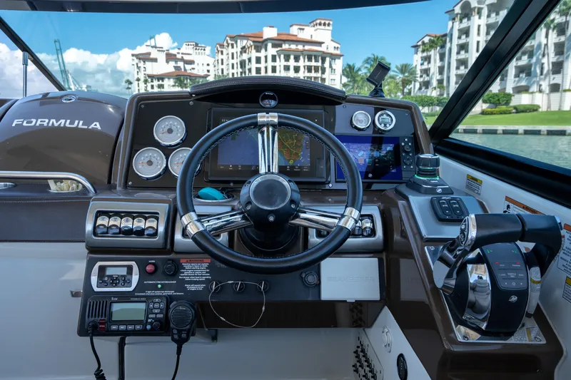 Slide: The Image of 2018 Formula 350 Crossover Bowrider OB helm with advanced navigation and control systems. - 30
