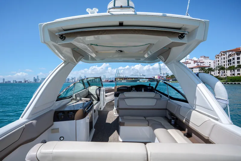 Slide: The Image of 2018 Formula 350 Crossover Bowrider OB on water, luxurious interior, city skyline background. - 34