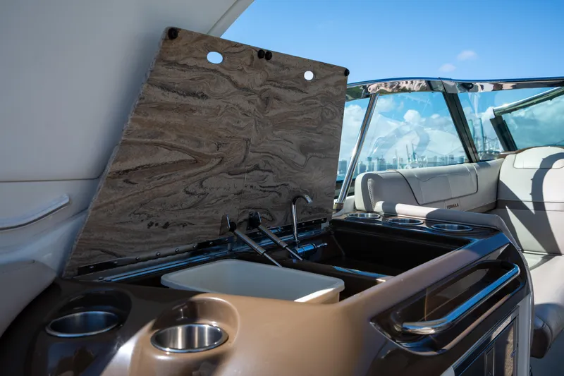 Slide: The Image of 2018 Formula 350 Crossover Bowrider OB interior with sink and seating area. - 38