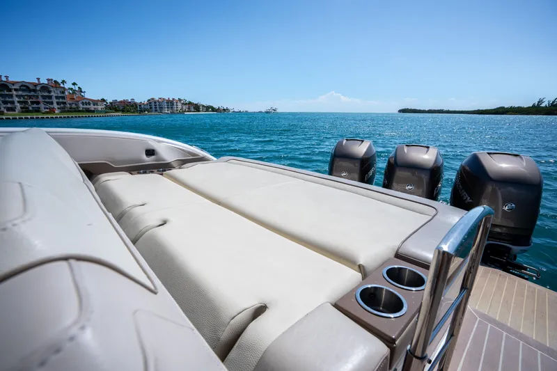Slide: The Image of 2018 Formula 350 Crossover Bowrider OB on water, showcasing luxurious seating and powerful outboard engines. - 40