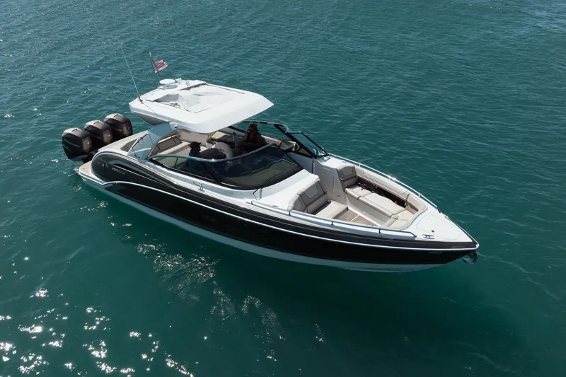 Slide: The Image of 2018 Formula 350 Crossover Bowrider OB cruising on clear blue water. - 5