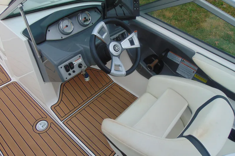 Slide: The Image of 2015 Yamaha AR190 boat interior with steering wheel and dashboard. - 10