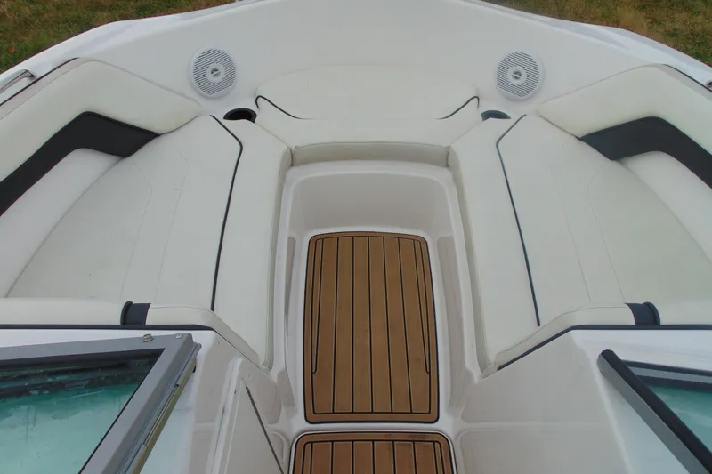 Slide: The Image of 2015 Yamaha Boats AR190 interior with cushioned seating and teak-style flooring. - 13