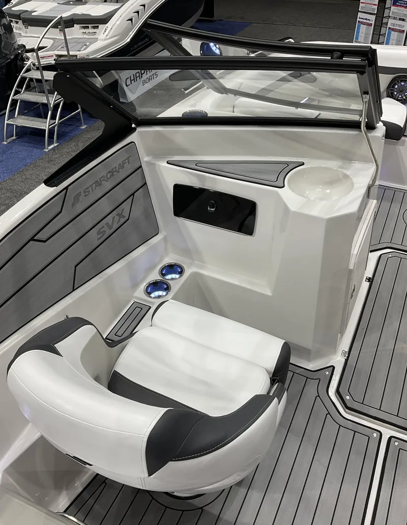 Slide: The Image of 2024 Starcraft SVX 190 OB DC boat interior with captain's chair and dashboard. - 7