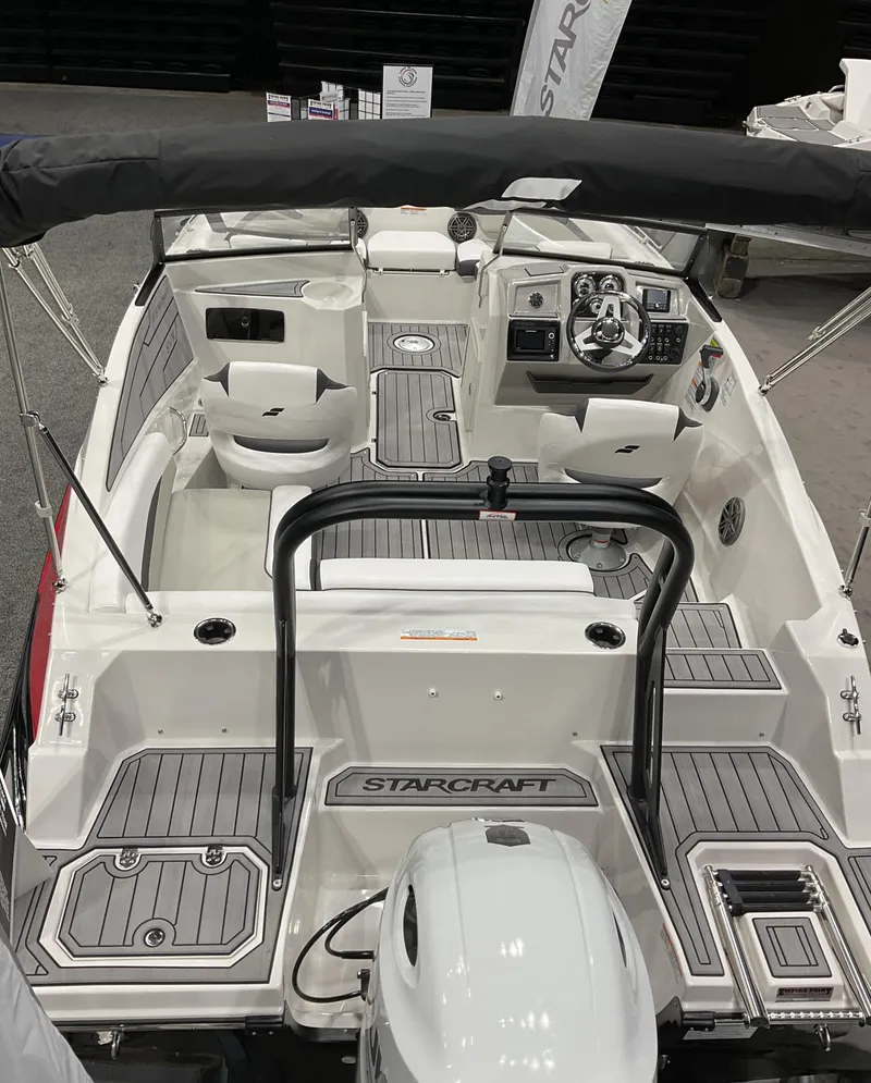 Slide: The Image of 2024 Starcraft SVX 190 OB DC boat interior with seating and control panel. - 9