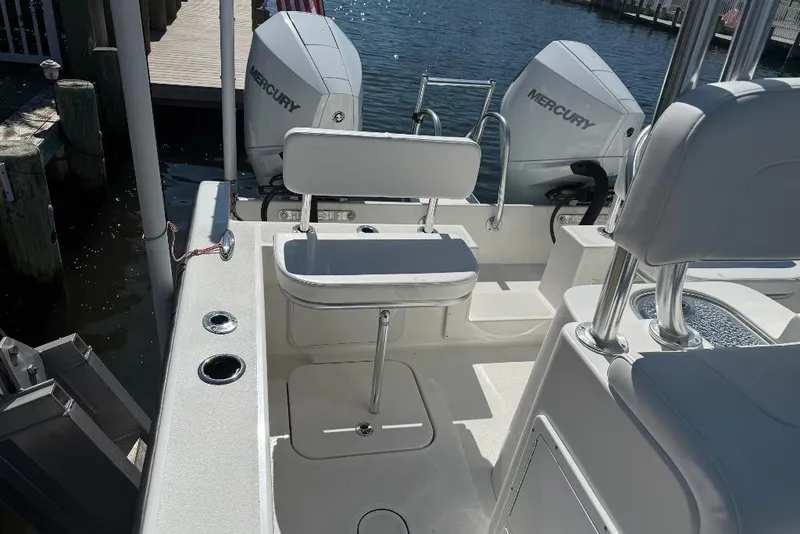 Slide: The Image of 2025 Tideline 235 Hybrid boat interior with seating and Mercury engines. - 15