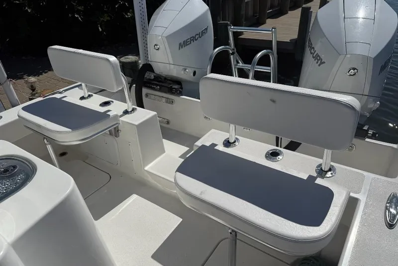 Slide: The Image of 2025 Tideline 235 Hybrid boat interior with dual Mercury engines and seating. - 16