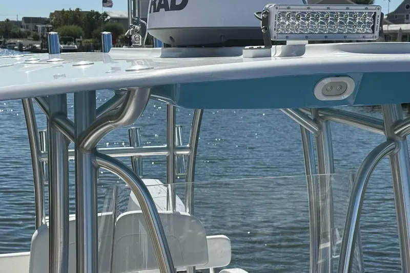 Slide: The Image of 2025 Tideline 235 Hybrid boat with radar and LED light bar on water. - 25