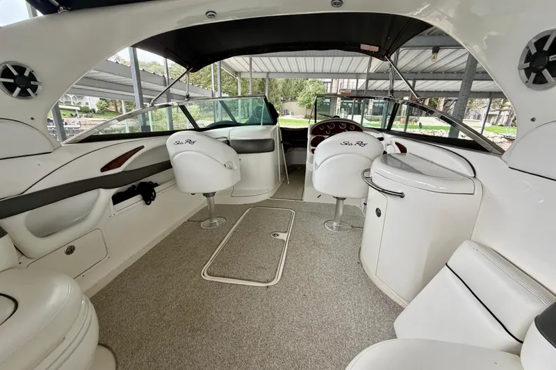 Slide: The Image of 2007 Sea Ray 290 SLX boat docked under covered marina. - 10