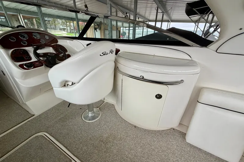 Slide: The Image of 2007 Sea Ray 290 SLX boat docked with "Sink or Swim" decal on the stern. - 11