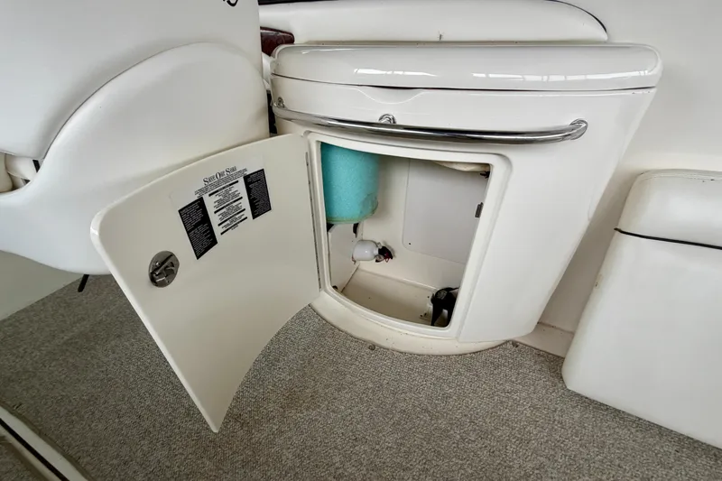 Slide: The Image of 2007 Sea Ray 290 SLX boat interior with steering wheel and captain's chair. - 12
