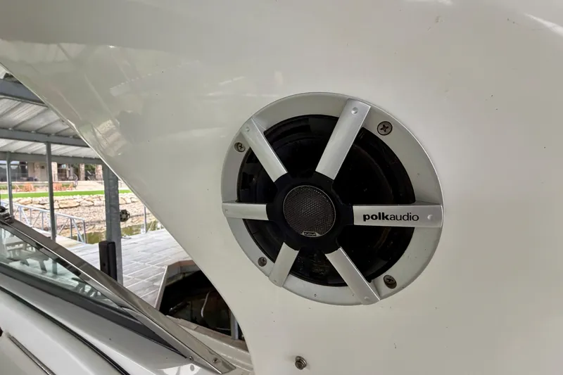 Slide: The Image of 2007 Sea Ray 290 SLX boat interior with white seating and lake view. - 14