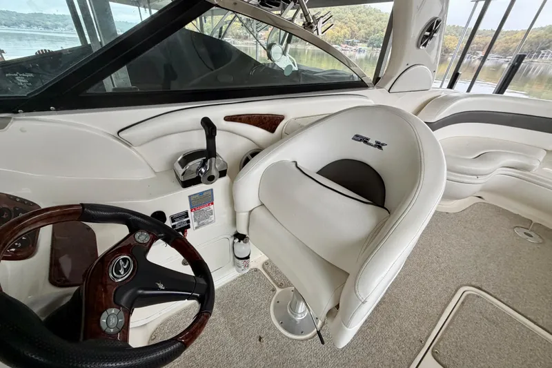 Slide: The Image of Interior of a 2007 Sea Ray 290 SLX boat with seating and helm. - 17