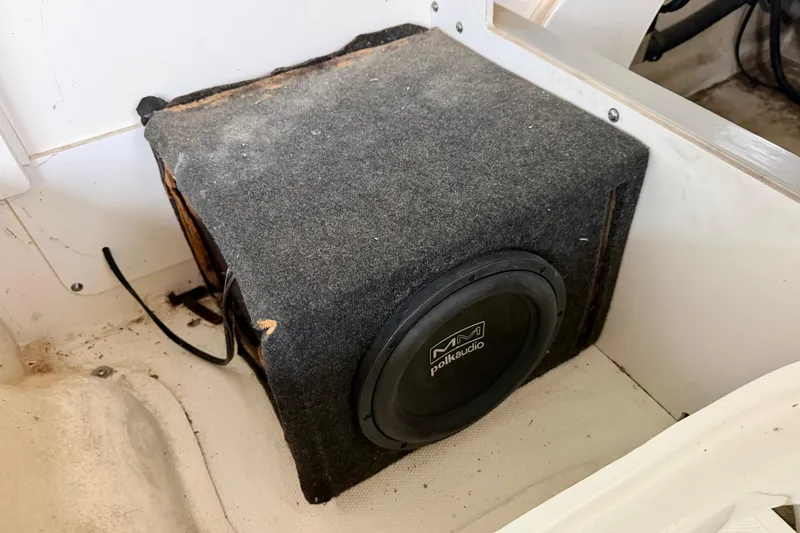 Slide: The Image of 2007 Sea Ray 290 SLX boat sink with faucet and storage compartment. - 24