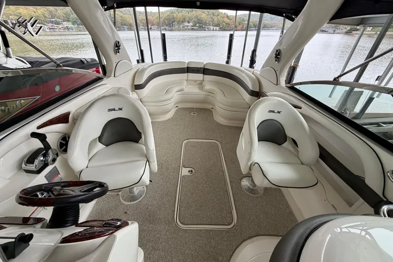 Slide: The Image of Interior cabin of 2007 Sea Ray 290 SLX boat, featuring beige walls and flooring. - 30