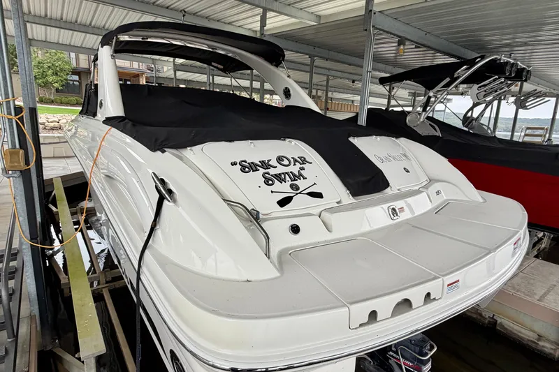 Slide: The Image of 2007 Sea Ray 290 SLX boat dashboard with steering wheel and control panel. - 4