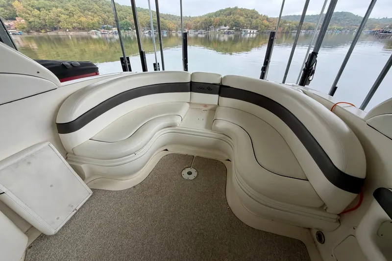 Slide: The Image of 2007 Sea Ray 290 SLX boat docked under covered marina. - 7