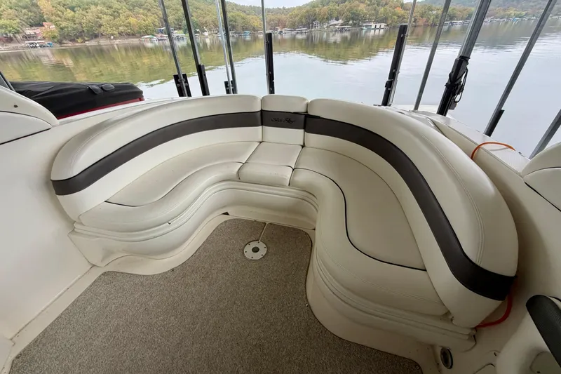 Slide: The Image of 2007 Sea Ray 290 SLX boat docked in a covered marina, side view. - 8