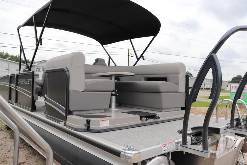 Slide: The Image of 2024 Premier 250 Solaris Rev pontoon boat with spacious seating and canopy. - 10