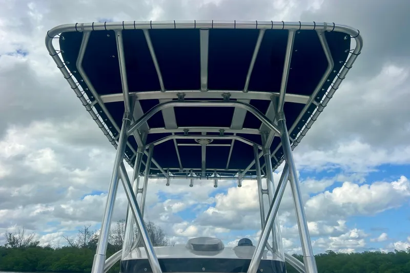Slide: The Image of Boston Whaler 230 Dauntless 2009 boat with T-top against cloudy sky. - 15