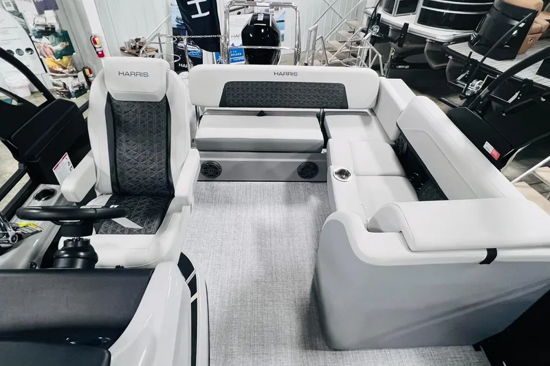Slide: The Image of 2025 Harris Solstice 250 boat interior with luxurious seating and modern design. - 11