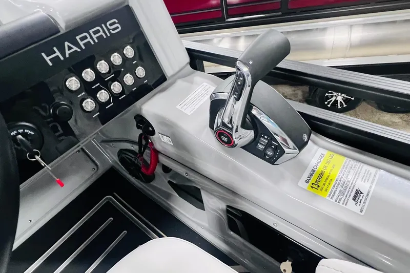 Slide: The Image of Control panel of 2025 Harris Solstice 250 boat with throttle and switches. - 30