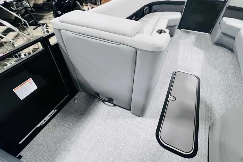 Slide: The Image of 2025 Harris Solstice 250 interior with gray seating and flooring, showcasing modern design. - 37