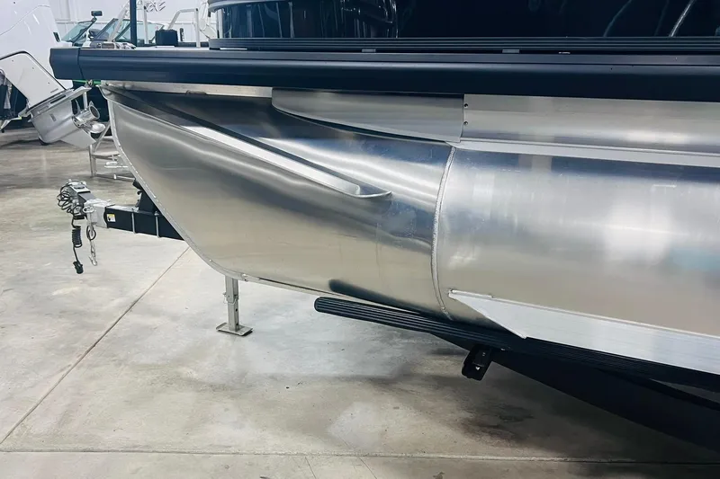 Slide: The Image of 2025 Harris Solstice 250 pontoon boat in showroom, showcasing sleek aluminum design. - 51