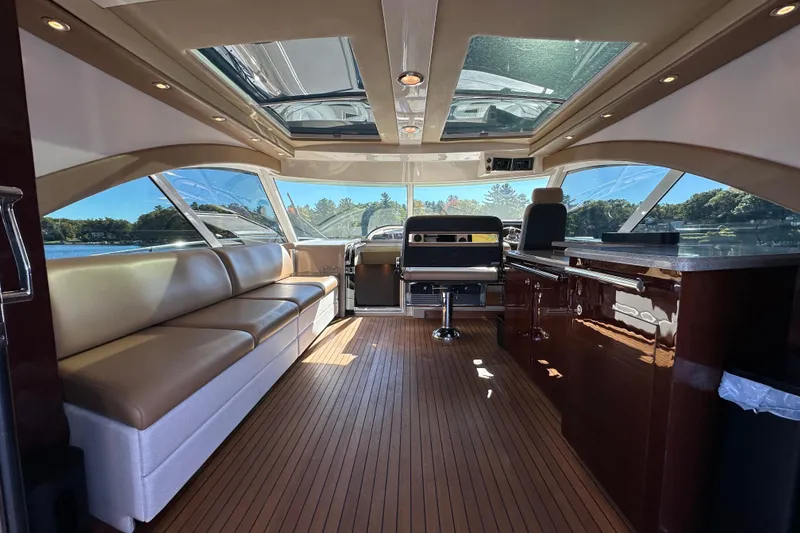 Slide: The Image of Luxurious interior of 2007 Sea Ray 60 Sundancer yacht with leather seating and panoramic windows. - 10