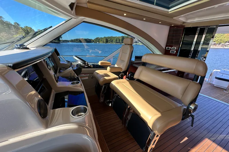 Slide: The Image of Luxurious 2007 Sea Ray 60 Sundancer yacht interior with leather seating and scenic water view. - 13