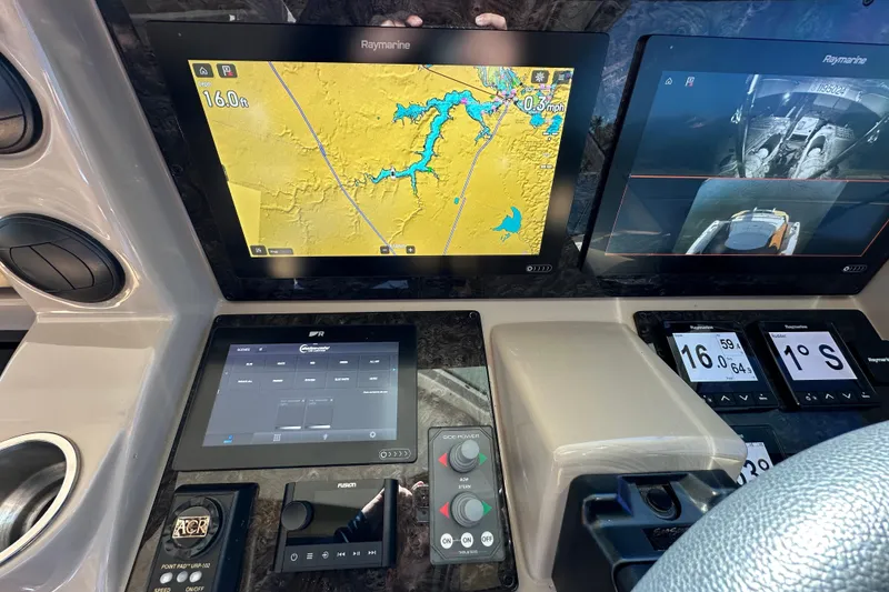 Slide: The Image of Control panel of a 2007 Sea Ray 60 Sundancer with navigation and monitoring screens. - 15