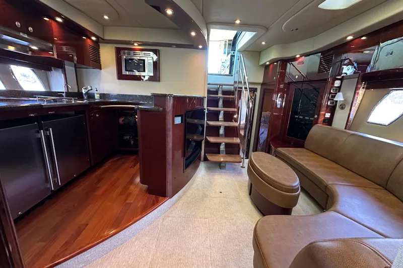 Slide: The Image of Luxurious interior of 2007 Sea Ray 60 Sundancer yacht with modern kitchen and seating area. - 20