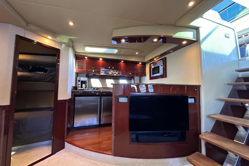 Slide: The Image of Luxurious interior of 2007 Sea Ray 60 Sundancer yacht with modern kitchen and entertainment area. - 21