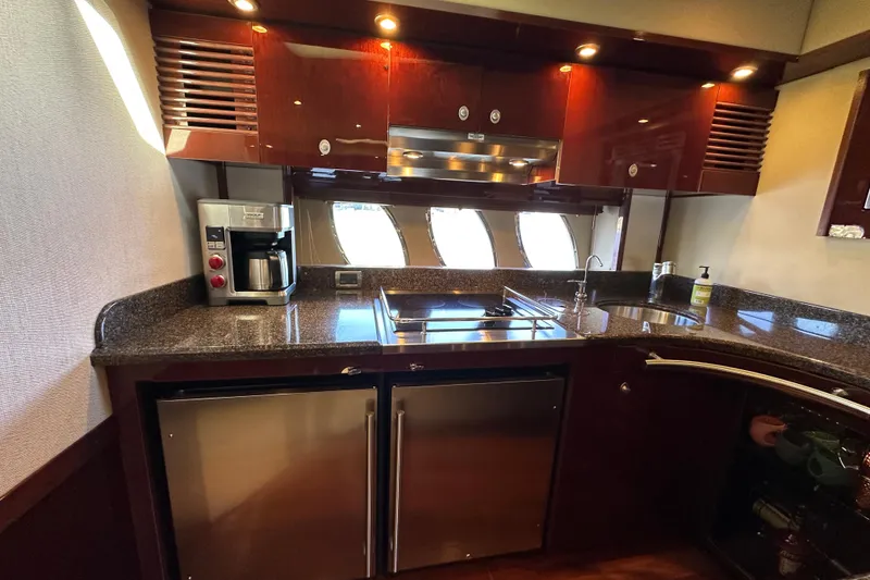 Slide: The Image of Luxurious kitchen interior of 2007 Sea Ray 60 Sundancer yacht with modern appliances. - 22