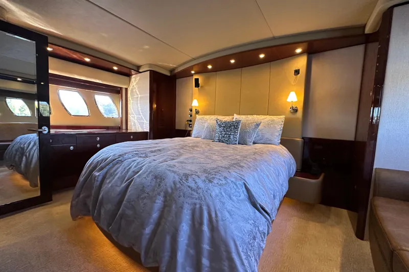 Slide: The Image of Luxurious bedroom interior of 2007 Sea Ray 60 Sundancer yacht with elegant bedding and lighting. - 26