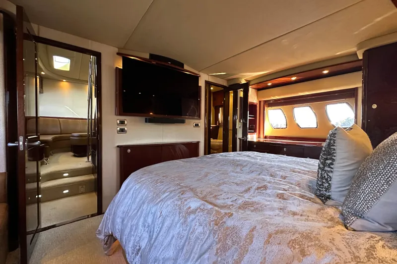 Slide: The Image of Luxurious bedroom interior of 2007 Sea Ray 60 Sundancer yacht with elegant decor. - 27