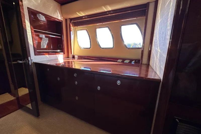 Slide: The Image of Luxurious interior of 2007 Sea Ray 60 Sundancer yacht with elegant wood cabinetry and windows. - 29