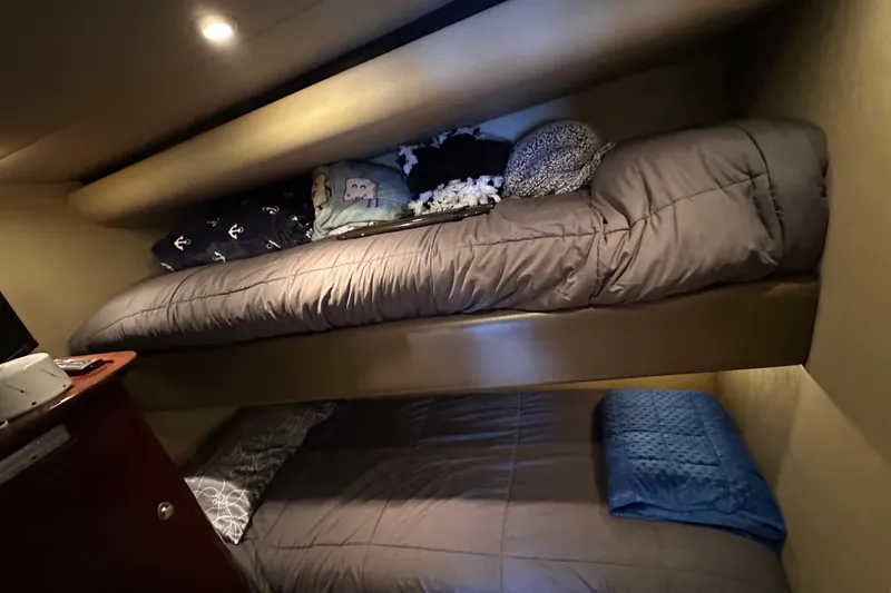 Slide: The Image of Bunk beds in 2007 Sea Ray 60 Sundancer yacht cabin with cozy bedding and pillows. - 37